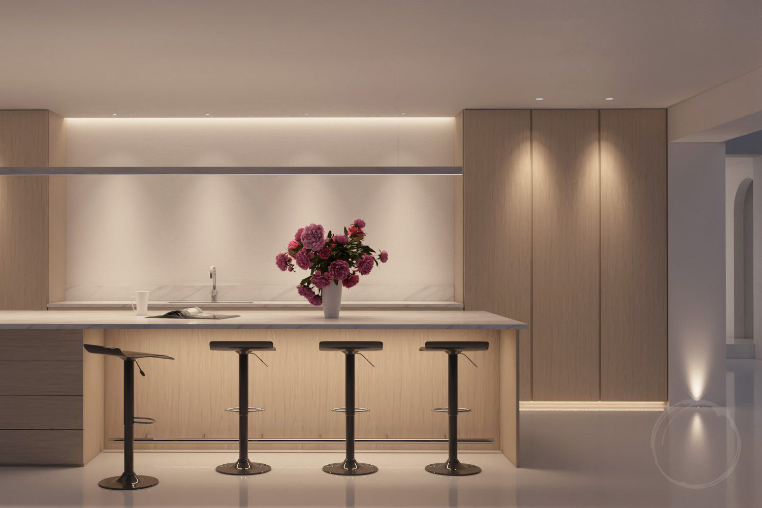 A kitchen island with a vase of pink flowers at on top with a news papper